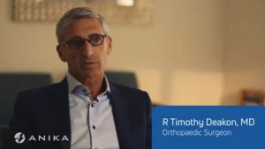 Dr R Timothy Deakon, orthopaedic surgeon, seated for a video interview about Cingal