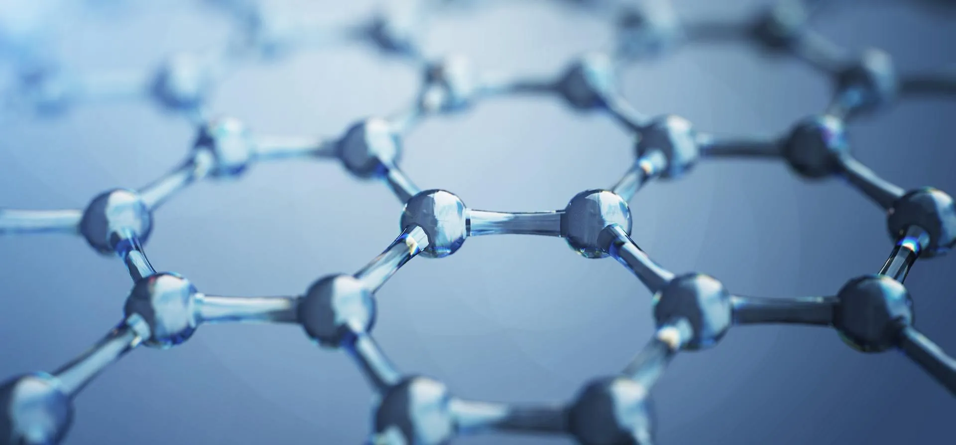 Modèle de structure moléculaire montrant des atomes et des liaisons connectés dans des tons bleus métalliques, représentant des composés chimiques ou la nanotechnologie.